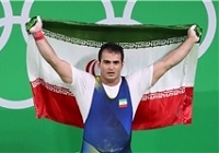 عکس/ ادای‌احترام قهرمان المپیک به شهید مدافع حرم