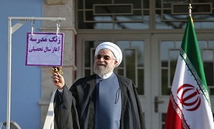President Rouhani rings bell for new school year in Tehran