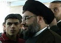 عکس/ نصرالله در کنار پسرش