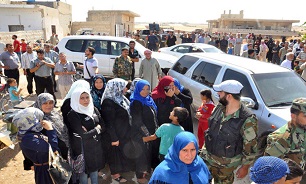 Hundreds of displaced families return to their homes in northern Hama