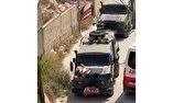 Zionist cruel forces strap wounded Palestinian to jeep