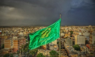 تصاویر/ برگزاری مراسم اهتزاز پرچم حرم رضوی بر فراز شهر همدان