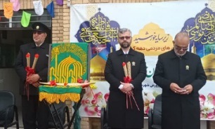 تصاویر/ مراسم استقبال از پرچم حرم رضوی در فامنین