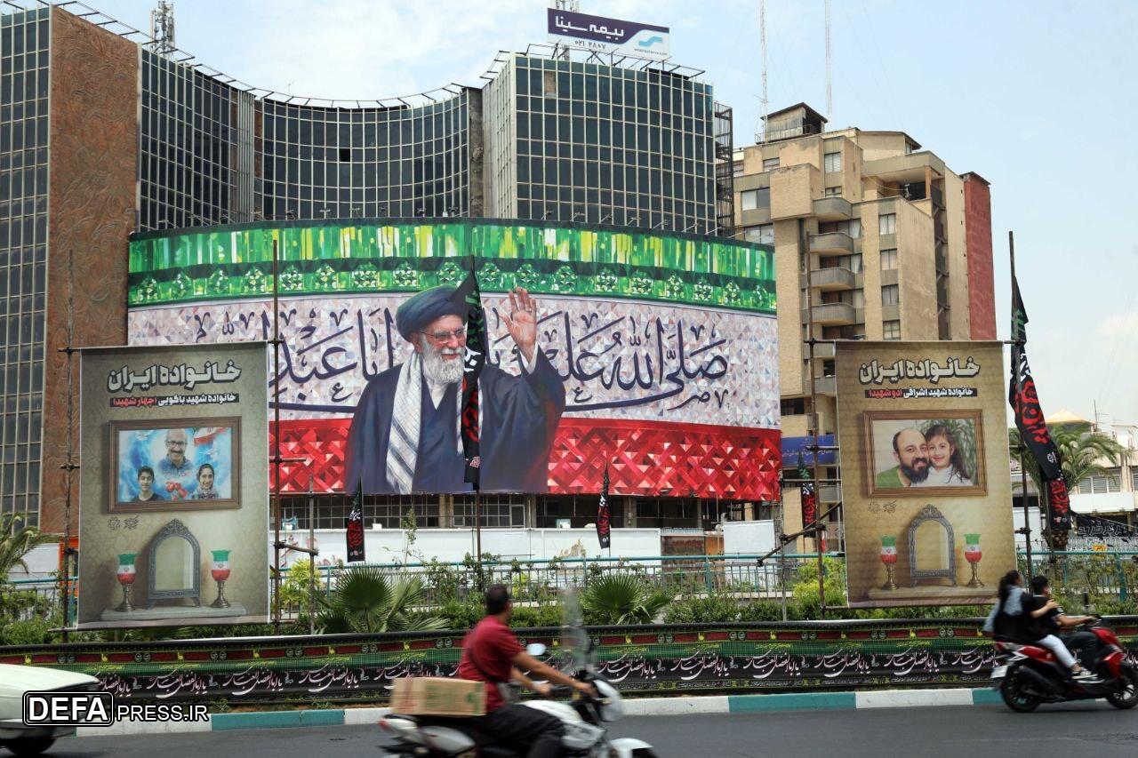 اکران تصاویر خانواده‌های شهید حملات رژیم صهیونیستی در میدان ولیعصر تهران