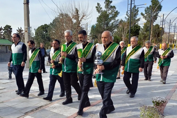 تصاویر/ ادای احترام خادمان رضوی به مقام شامخ شهدای امامزاده محمد (ع)