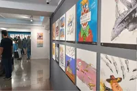 نمایشگاه «پوزه بند» افتتاح شد/ واکنش کاریکاتوریست‌ها به جنایات جنگی