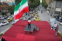 فیلم/ تصاویر هوایی از اهتزاز پرچم ایران در کرمانشاه